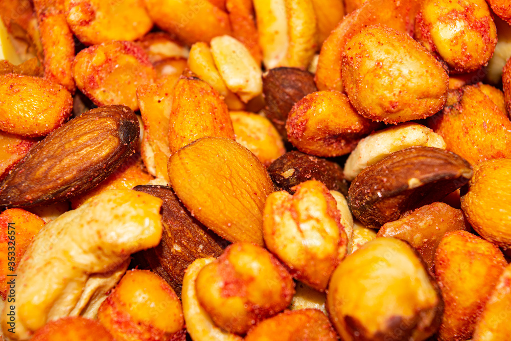 A mixture of different nuts. Healthy food, fitness diet. Surface texture. Close up. A mixture of different nuts. Healthy food, fitness diet. Surface texture. Close up.