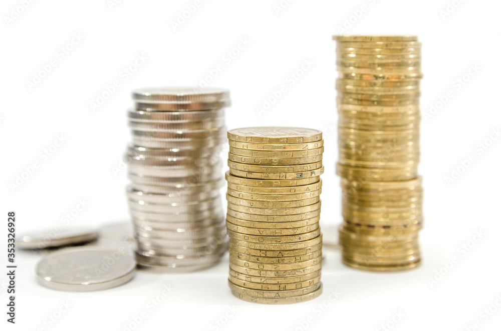 different stacks of coins isolated on white background. Business concept. Lots of coins. Savings concept.