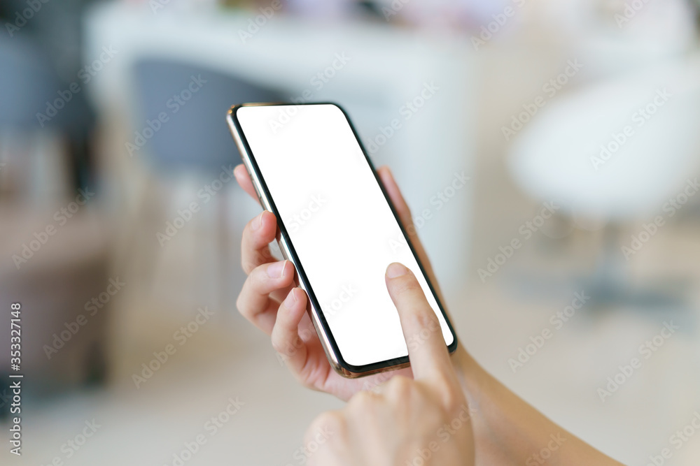 Mockup image of hand holding mobile phone with blank white screen. Mockup image of hand holding mobile phone with blank white screen.