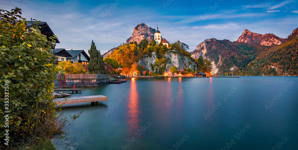 Dramatic evening view of Johannesbergkapelle church. Amazing scene of Traunsee lake. Colorful autumn landscape of Austrian Alps with Traunstein peak on background, Austria, Europe.