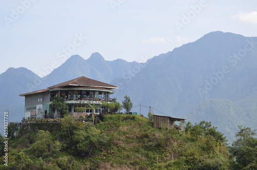 Hotel and Restaurant in Sapa, Vietnam with Blue Grey Mountains in Background