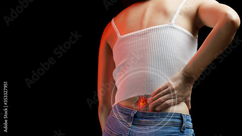 Lower back pain. Woman holding her back in pain. Medical concept.