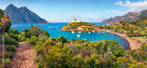 Panoramic morning view of Port de Girolata - place, where you can't get by car. Splendid summer scene of Corsica island, France, Europe. Stunning Mediterranean seascape.