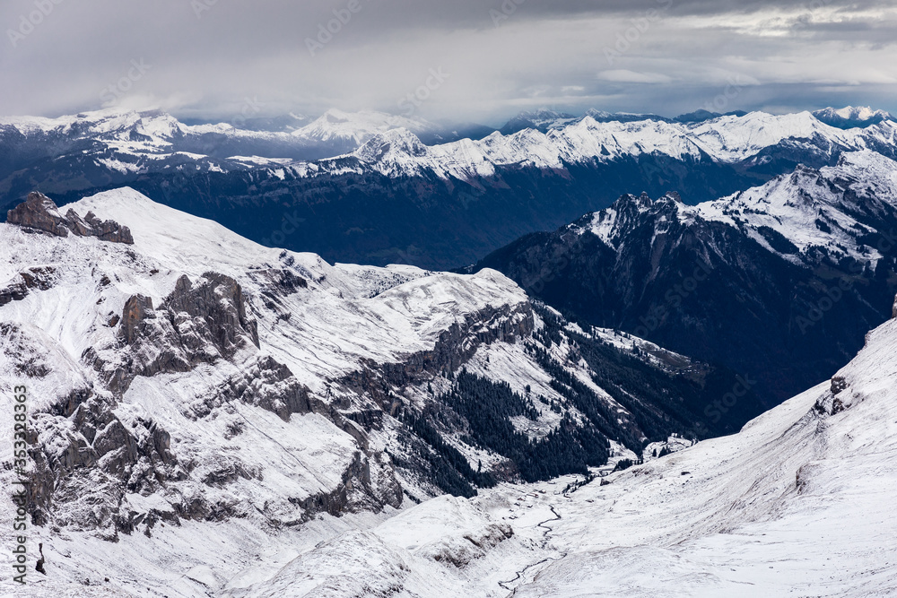 Obraz premium Snow capped mountains in Switzerland in winter.