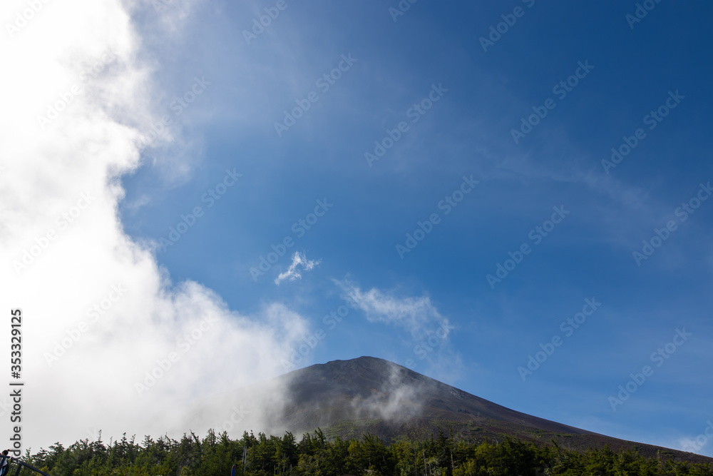 A mountain on the edge of Lake Yamanaka in Japan, foggy in the morning. A mountain on the edge of Lake Yamanaka in Japan, foggy in the morning.