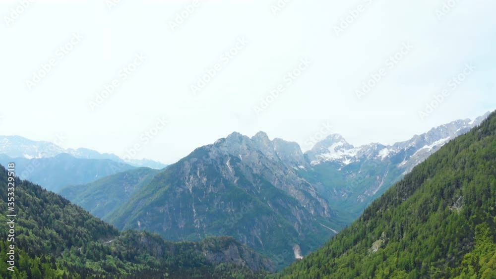 Aerial drone view, beautiful mountains with snow and forest, European Alps, sunny day, 4K. Aerial drone view, beautiful mountains with snow and forest, European Alps, sunny day, 4K.