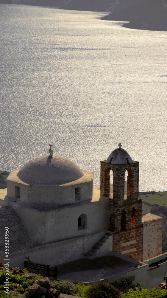 View of church and natural harbour in a Cycladic island