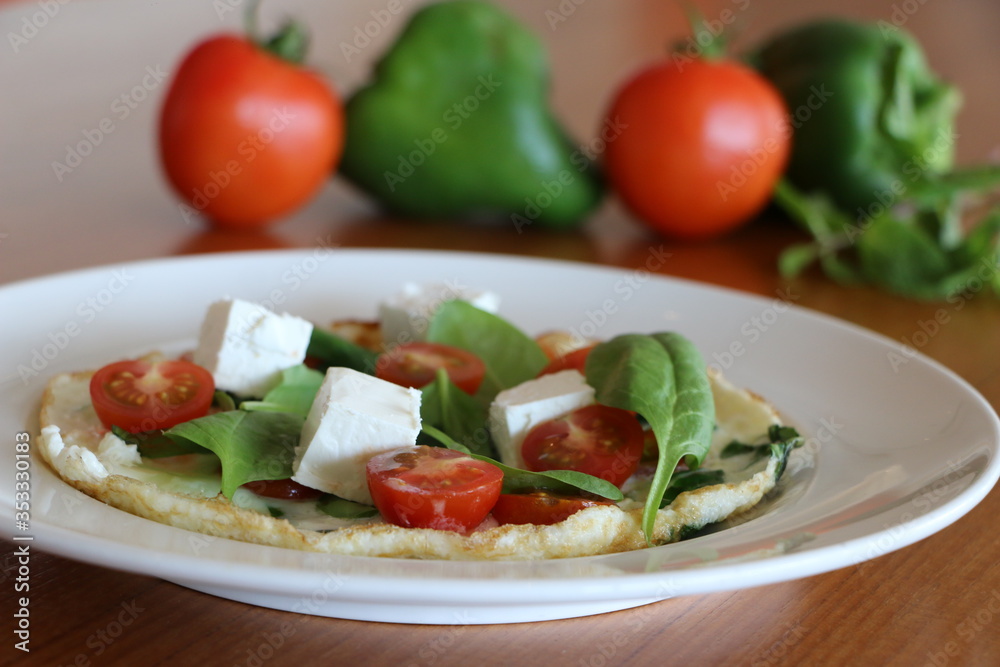 Egg white omelet, Egg white omelet filled with baby spinach,
cherry tomato, feta cheese and protein bread