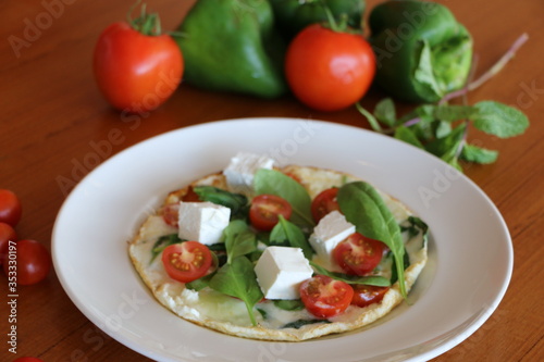Egg white omelet, Egg white omelet filled with baby spinach, cherry tomato, feta cheese and protein bread