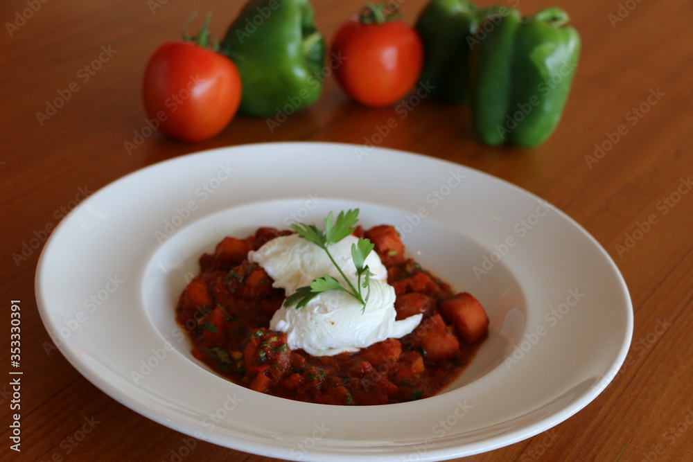 Shakshouka, Tomato based shakshouka with onion, garlic, lamb sausage and 2 baked eggs 