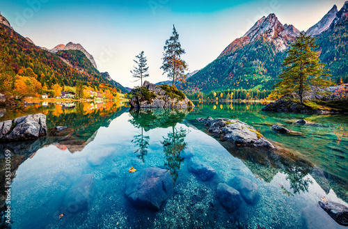 Astonishing autumn view of Hintersee lake with Hochkalter peak on background, Germany, Europe. Calm morning view of Bavarian Alps. Beauty of nature concept background. photo