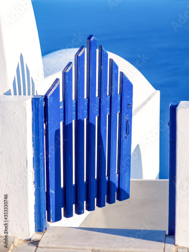 Blue wooden door  entrance to cave house. Santorini  Cyclades  Greece