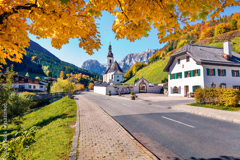Splendid morning scene of Parish Church of St. Sebastian. Colorful autumn view of Bavarian Alps, Ramsau bei Berchtesgaden village location. Bright outdoor scene of Germany countryside, Europe.