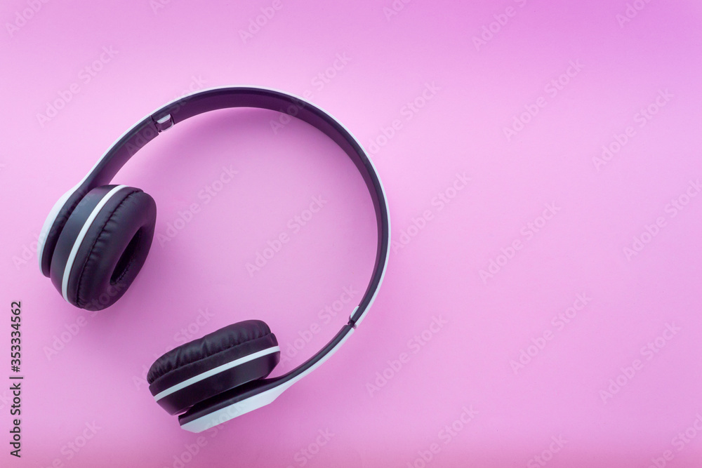 Headphone on pink background in top view Headphone on pink background in top view