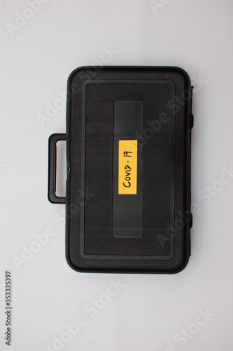 Corona Virus treatment kit in a black suitcase © Tejjas