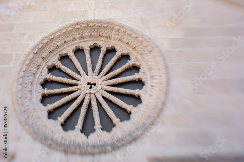 rose window of an old building in Kotor