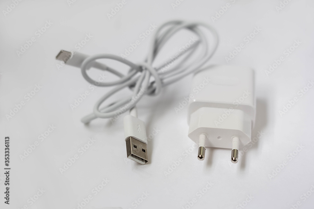Fototapeta premium white phone charger on a white background