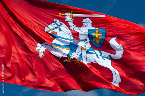 Canvas Print Close up of historic Lithuanian flag - Vytis waving in the wind on a sunny day