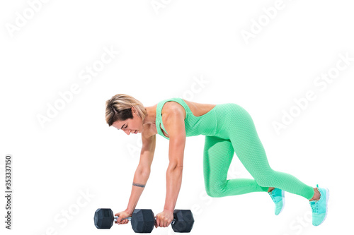 Fit sexy woman doing plank exercise on dumbbells isolated over white background.