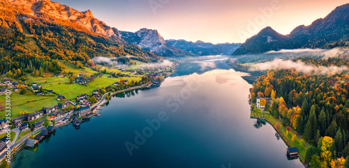 View from flying drone. Unbelievable morning scene of Grundlsee lake. Aerial autumn view of Eastern Alps, Liezen District of Styria, Austria, Europe. Traveling concept background.