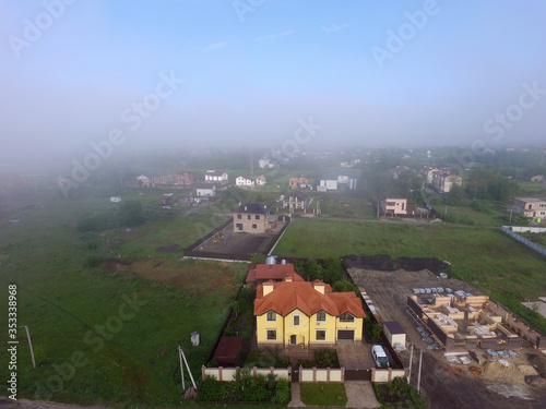 Aerial view saburb landscape (drone image). with the morning fog. Near Kiev