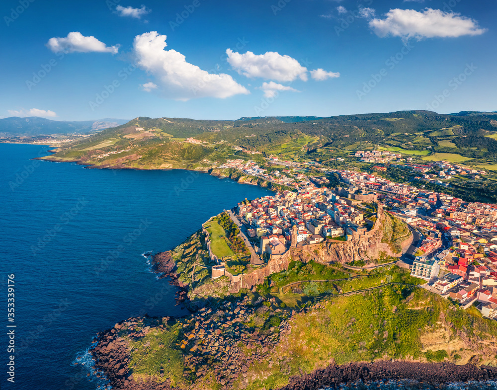 View from flying drone. Awesome spring cityscape of Castelsardo port. Aerial view of Sardinia island, Province of Sassari, Italy, Europe. Exciting morning seascape of Mediterranean sea.