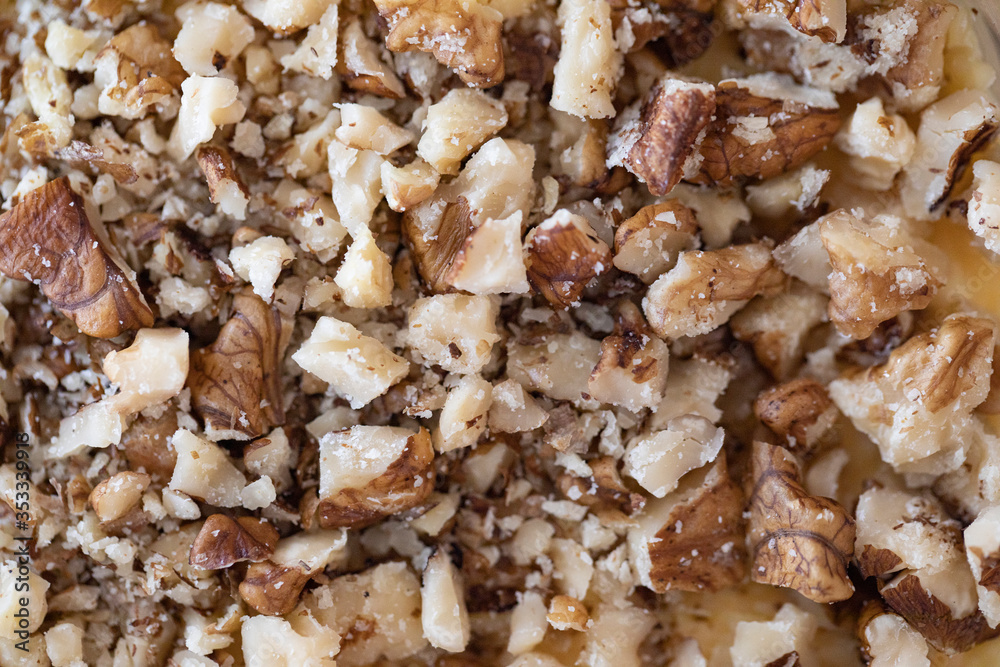close up of crushed walnuts as food background or texture close up of crushed walnuts as food background or texture