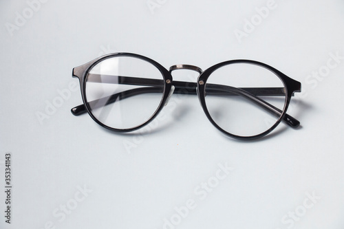 black round stylish glasses in a black frame on a white background