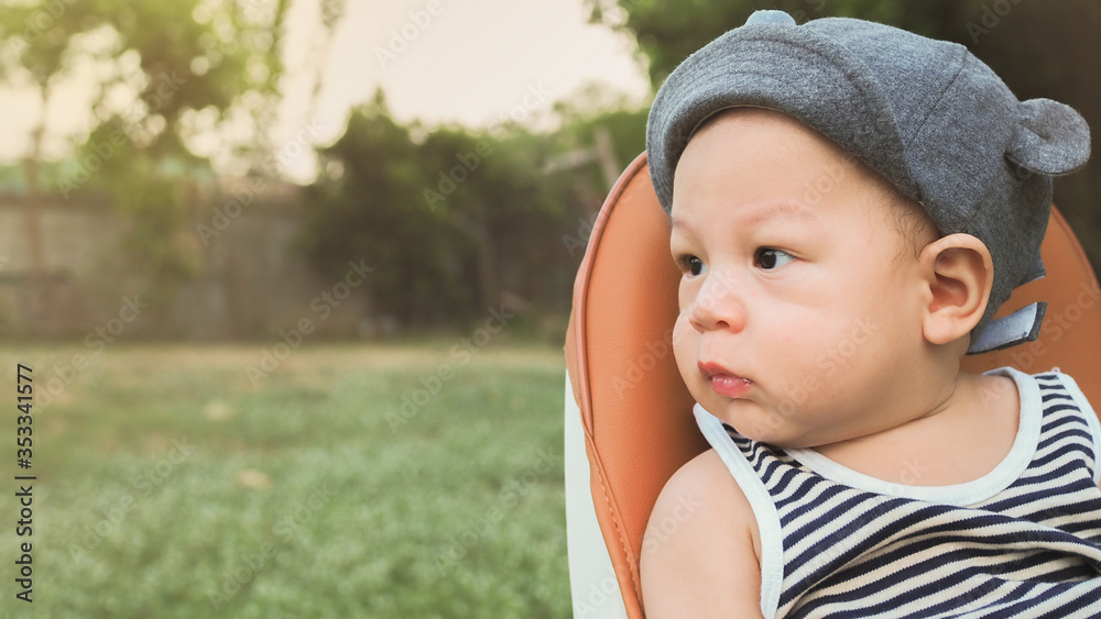 baby asian sitting in park,copy space baby asian sitting in park,copy space