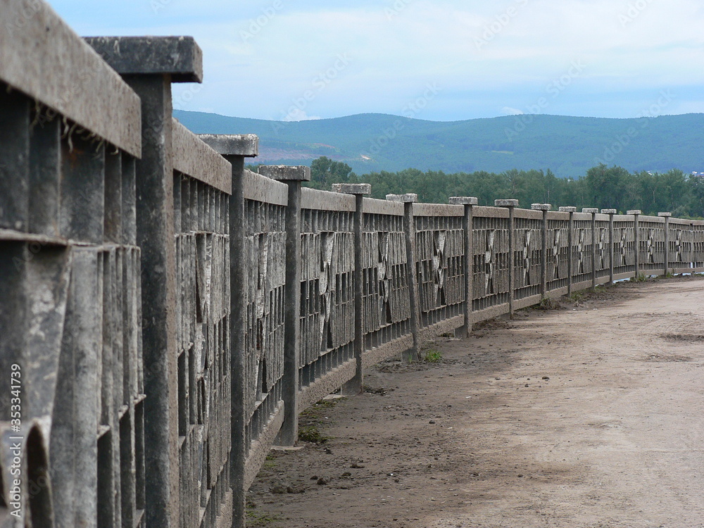 concrete fence along the river