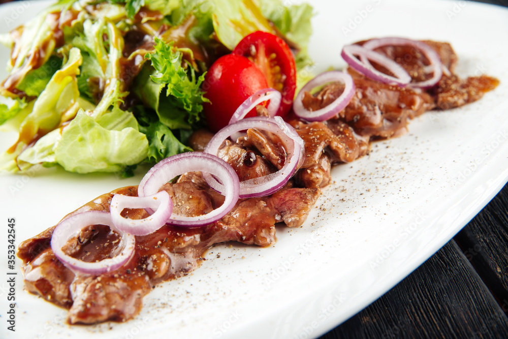 Gourmet cooked beef meat sauce onion ring salad Gourmet cooked beef meat sauce onion ring salad