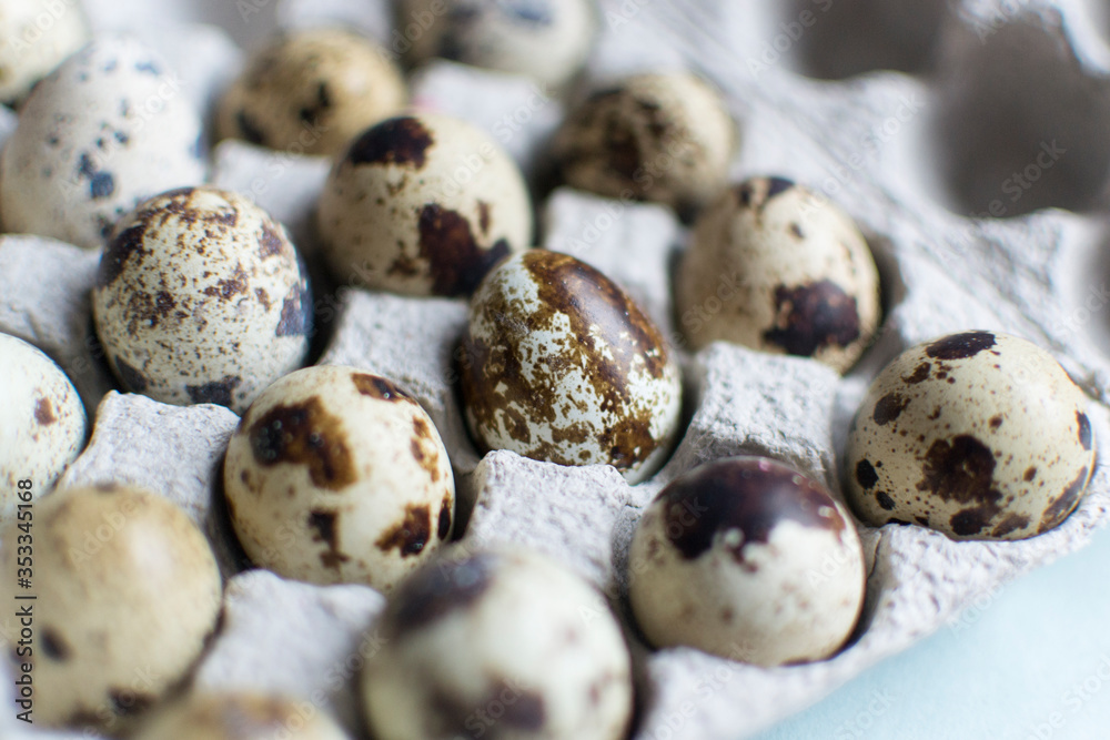 Quail eggs. Farm natural food in a cardboard box. Easter holiday. Spotted little eggs. Quail eggs. Farm natural food in a cardboard box. Easter holiday. Spotted little eggs.
