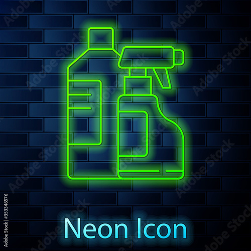 Glowing neon line Plastic bottles for laundry detergent, bleach, dishwashing liquid or another cleaning agent icon isolated on brick wall background. Vector Illustration.
