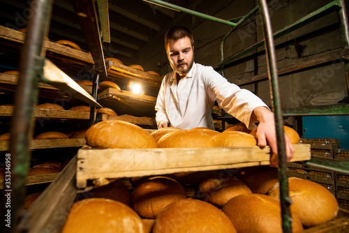 Bread. Bread production line. A man in uniform. Sanitary check. bakery