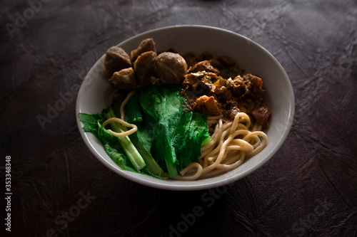 Indonesian Famous Foodstreet Bakso / Meatballs served with noodles and rice noodles photo