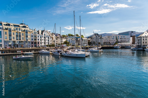 Alesund, Norway - June 2019: View of colorful Art Nouveau architecture in the port of the city of Alesund, Norway. Panoramic view of Alesunds architecture and docked sailing boats and vessels. © F8  \ Suport Ukraine