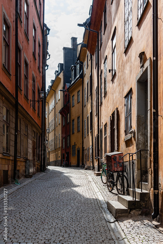 Photography View of narrow cobblestoned street in Gamla Stan, the medieval Old Town of Stock