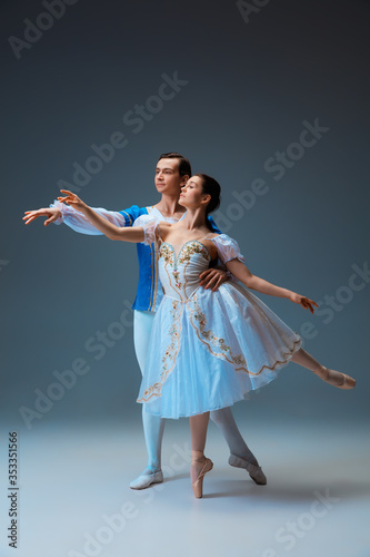 Obraz na plátně Young and graceful ballet dancers as Cindrella fairytail characters on studio background