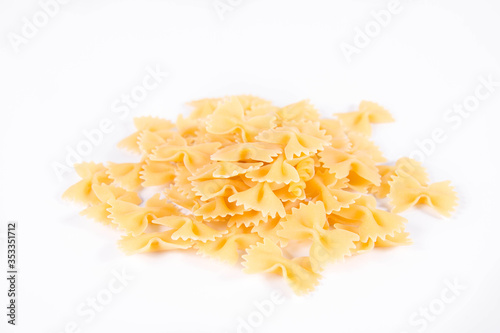 Raw Farfalle pasta on a white background