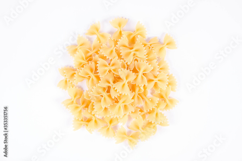 Raw Farfalle pasta on a white background