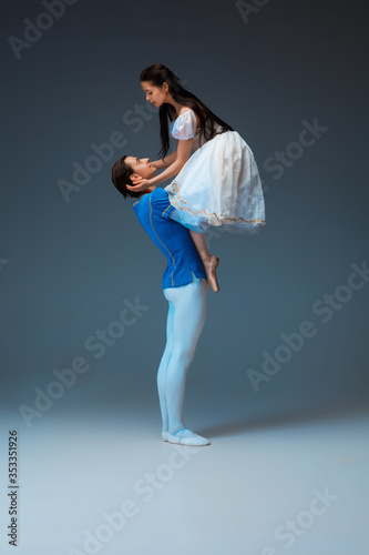 Obraz na plátně Young and graceful ballet dancers as Cindrella fairytail characters on studio background