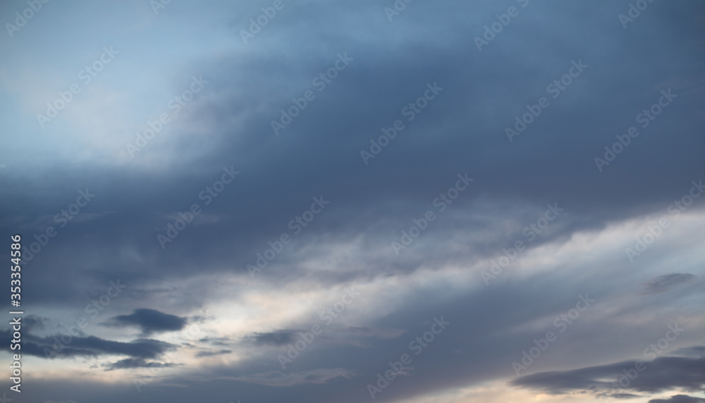 Sky background with dark clouds. Sky with gray clouds before the start of a thunderstorm or rain. Weather. Nature.