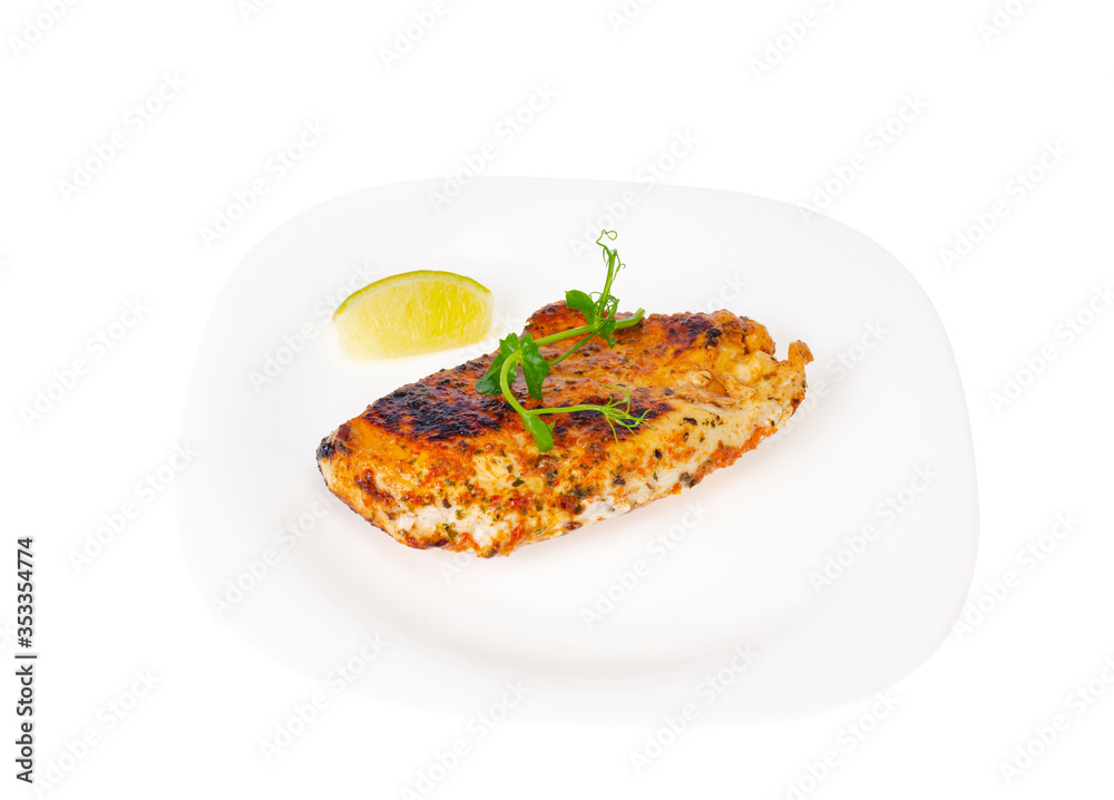 Piece of fried chicken with spices on white plate. Piece of fried chicken with spices on white plate.