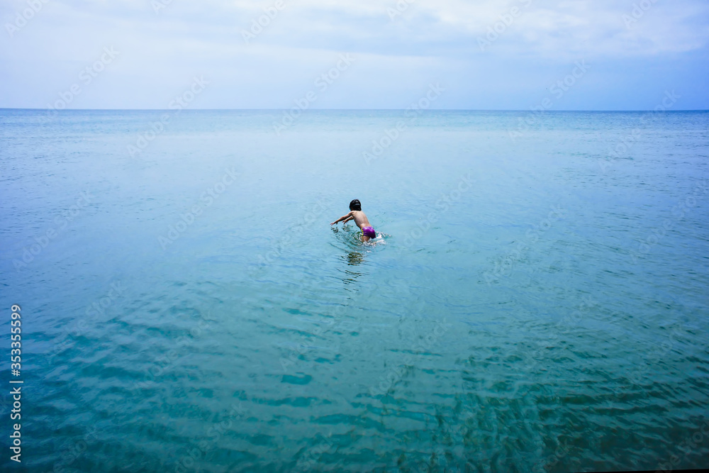 boy snorkeling in the sea