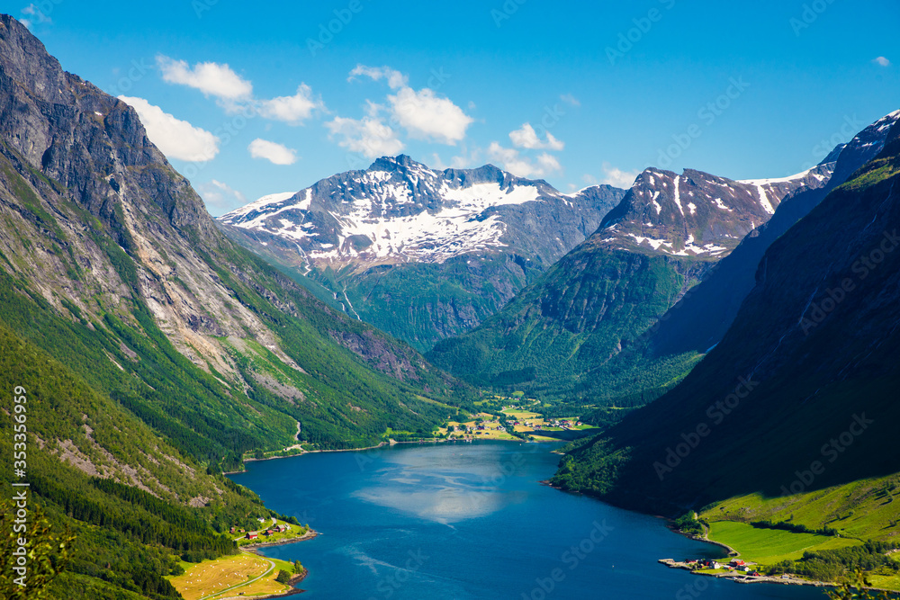 Fototapeta premium On top of the summit of Mount with incredible views of the Sunnmore Alps in Norway