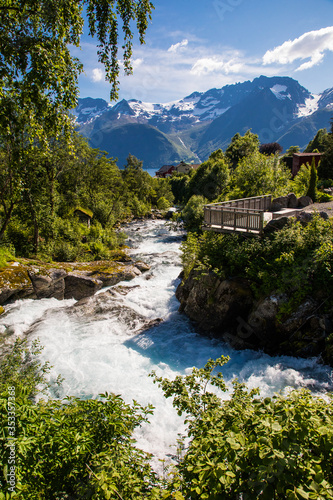 Picturesque scene of Urke village and Hjorundfjorden fjord  Norway. Drammatic sky and gloomy mountains. Landscape.