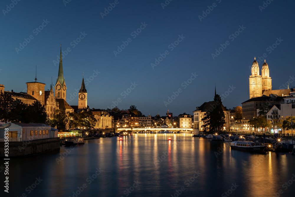 Zurich Cityscape in the evening with Limmat River and Grossmünnster und Fraumünster