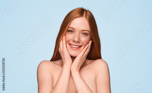 Pretty ginger model smiling for camera