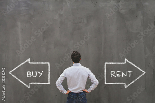 buy or rent choice, real estate concept,  businessman making decision photo