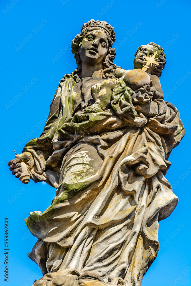 Statues of Madonna by Matej Vaclav Jackel on the north side of Charles Bridge over river Vltava in Prague, Czech Republic